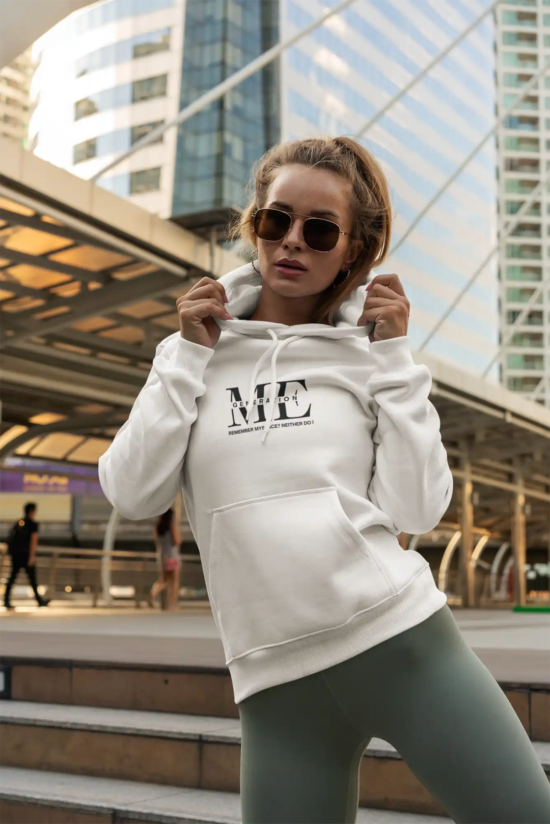 White hooded sweatshirt with ’ME’ text printed on the front.